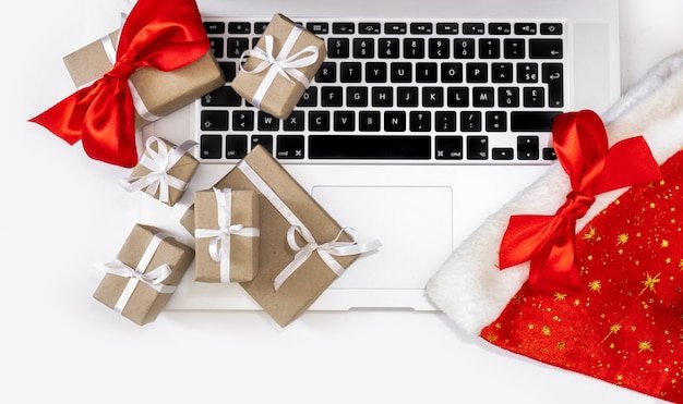 Laptop and gifts for christmas and new year celebration isolated on white  background | Premium Photo